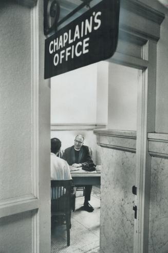 Interviewing a prisoner at the old city hall courts, Rev