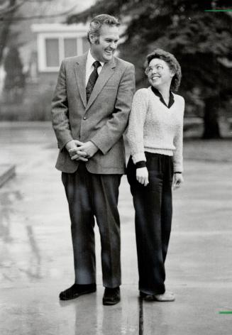 Contrasting clergy: Rev. Ron Nickle, the minister at Lansing United Church, and his assistant, Rev. Lynne Bandy, compare statures. She's five feet on good days. He's six feet, two inches