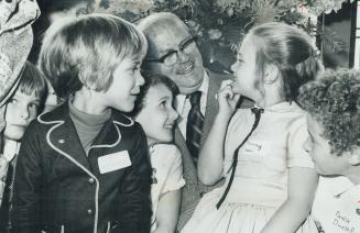 Look, no cavities: Seven-year-old Rosemary Leach shows Dr. Stewart MacGregor and other young former patients how he kept her teeth in good shape. The (...)