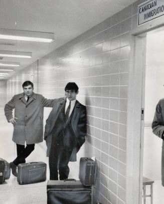 Sad farewell to canada. Yugoslav ship-jumpers Ante Ivancey and Slayko Smoljan wait forlornly at Toronto International Airport for deportation flight t(...)