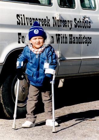 Handicapped kids get new van. Gabor Takacs, 4, is standing beside Silver Creek Nursery School's new van, which was donated by the Humber Valley Kiwani(...)