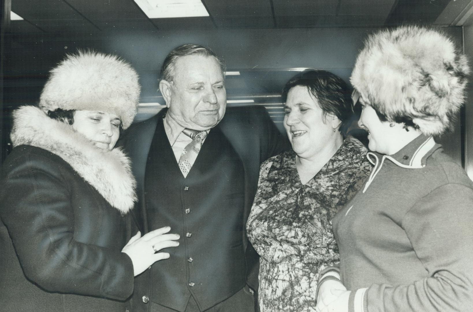 It's a greeting without words for Karl Graf and his daughters, Elizabeth (left), 42, Elsa, 45, and Rosa 35