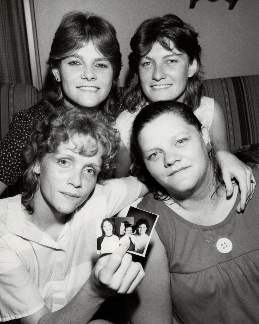 Together again: Evangeline Jensen, who searched seven years for Jill and Judy Peat (top) and Jodi Trudgian (lower right), holds photos of another two brothers and sister she has located