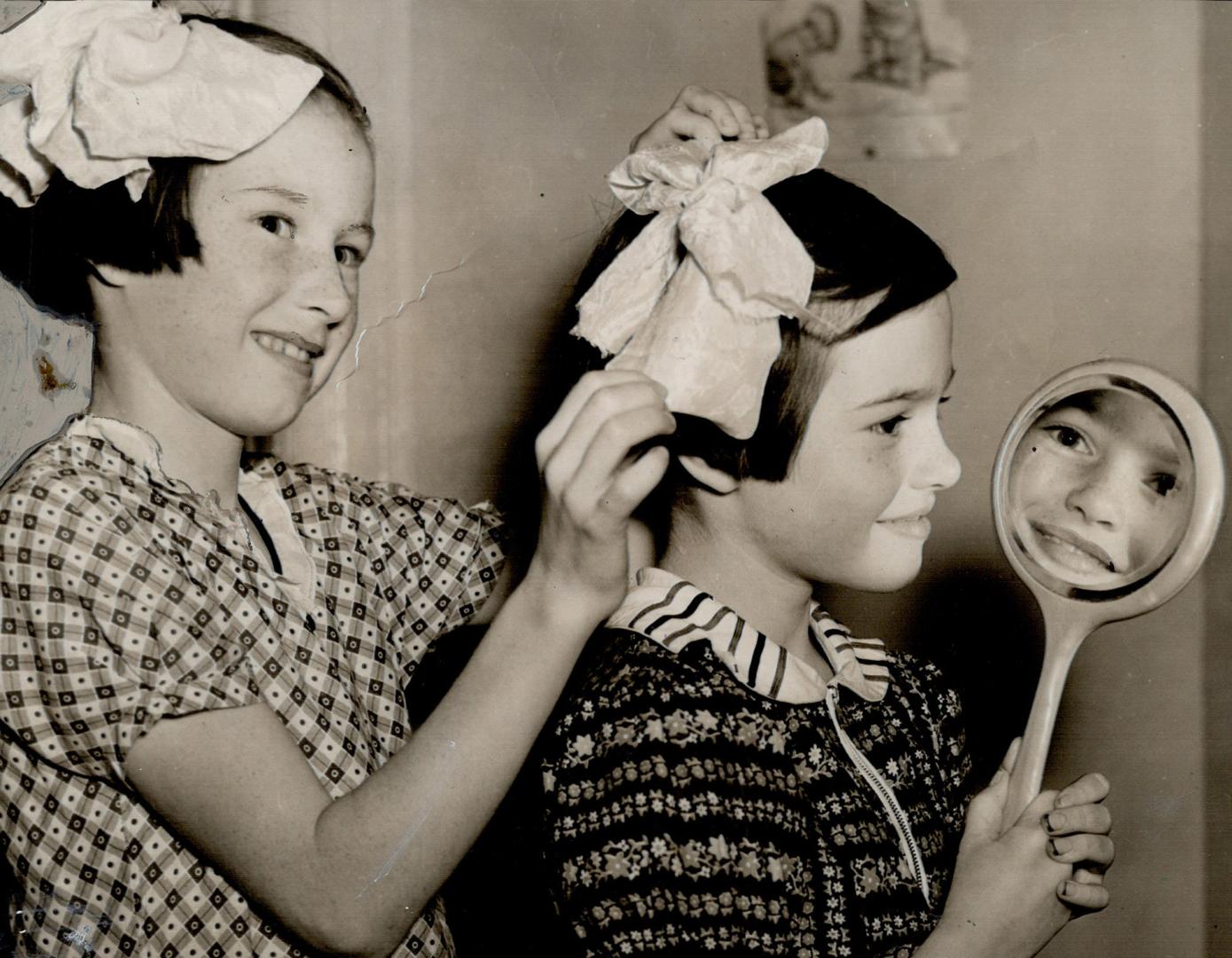 Getting ready. All the Nagle girls looked their best at the house-warming party and no wonder after all the time they spent prettying up. They helped welcome the guests