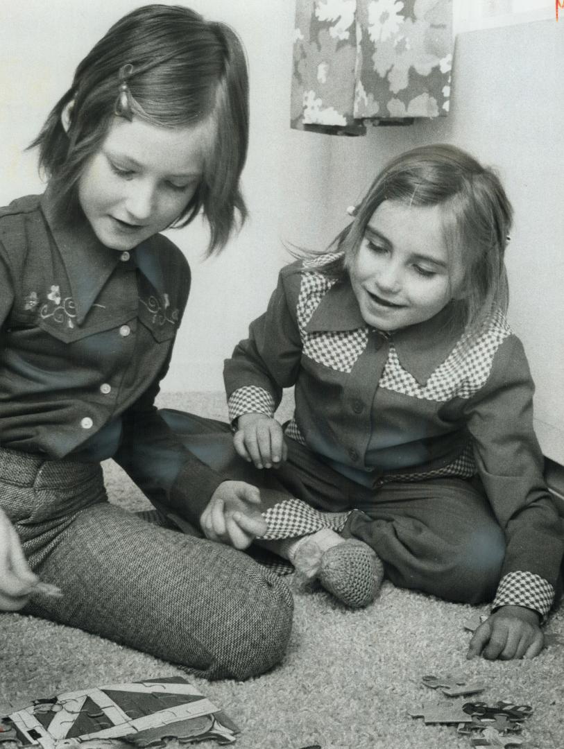 Left behind in Czechoslovakia when she was only 2 months old, 7-year-old Stella Petrovic (right) has been reunited with her parents, Peter and Kathy P(...)