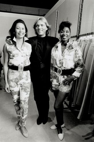 Great mix: German designer Otto Kern, posing with two of his models, is doing printed silks and cottons for spring