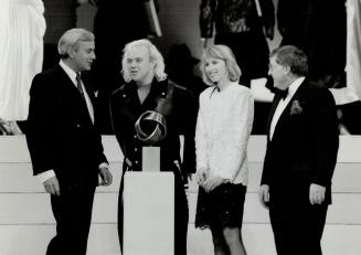 Award winner: Left to right, Premier David Peterson, designer Pierre Poisson, Shelley Peterson and Wool Bureau president Ross Henry