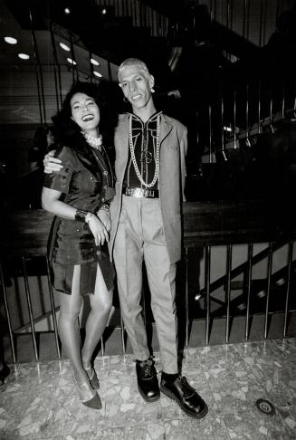 Chatelaine beauty editor Charmaine Gooden in Chanel-inspired red ribbon suit, with designer Keith Richardson