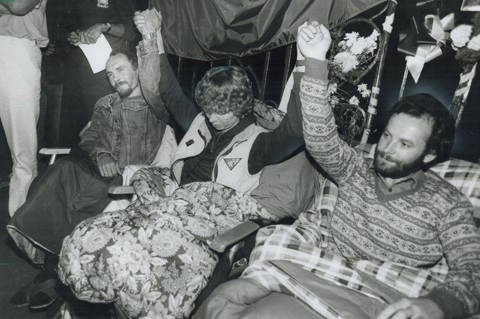 Victory! Triumphant Polish hunger strikers, from left, Zygmund Augustyniak, Graznia Trzesicka, and Wladyslaw Sliwa, raised their arms in victory at th(...)