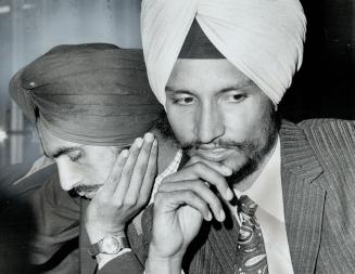 An Indian University student, Bhajan Singh Gill (right), and another of the 27 Indians who landed at Toronto International Airport last night wait for(...)