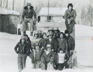 Rat Dam roundup: Like ingenuous members of a big family, school kids pose at village entrance (above),