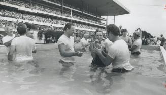 Baptismal ceremony: At Woodbine Racetrack last year, 15,000 Jehovah's Witness gathered to watch new members baptized into the faith by immersion in water