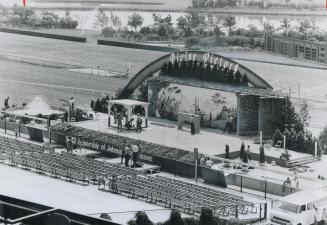 The stage for the Jehovah's Witnesses convention this week at Woodbine racetrack is in front of the track and the tote board (right). More than 30,000(...)