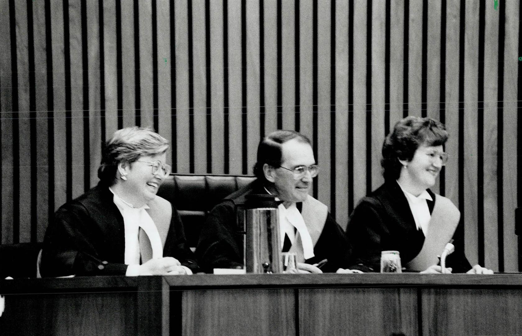 Sworn Smiles: Judge Mary F. Dunbar, right, and Judge Marion E. Lane flank Judge Donald August, regional senior judge of the Ontario Court of Justice, (...)