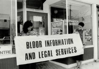 Everyone welcome: Mimi Johnson, left, and Heather MacFarlane raise banner