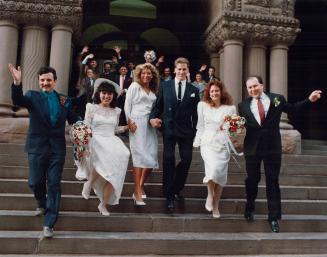 Cupid outdid himself yesterday at Toronto's old city hall as 12 couples took St