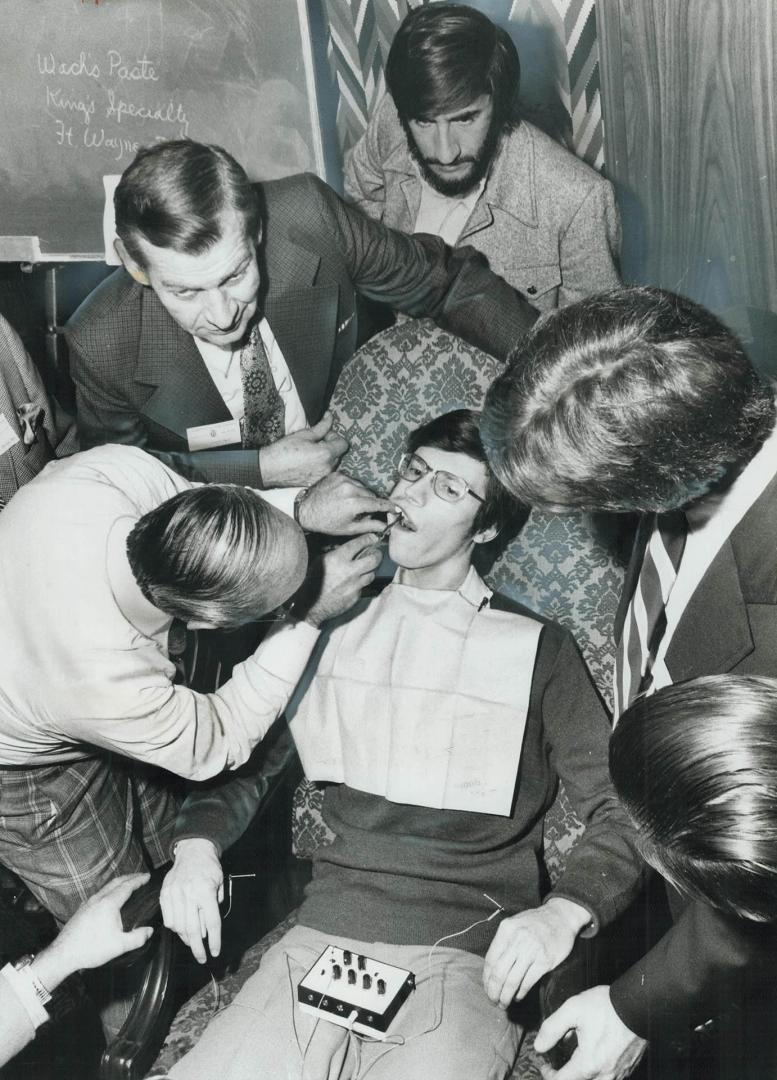 It still hurts: Acupuncture needles applied by Toronto dental surgeon Herbert Adirim failed to anesthetize patient Kenneth Weiker at a demonstration for dentists and students last week