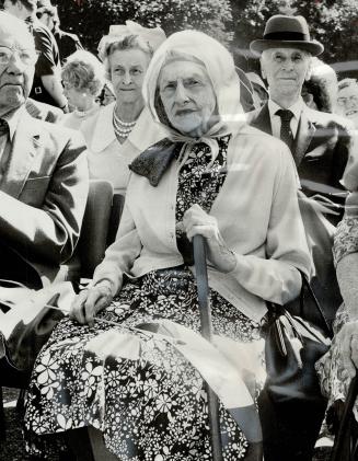 Waving goodbye at the camp of the Armed Forces jet that took her home, the Queen Mother ends her week's visit to Canada