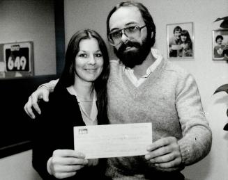 Victor and Pina Ravenese, at left, beamed happily after they picked up their $277,265 Lotto 6/49 cheque yesterday, as did Henry, Hudson and his fiance(...)