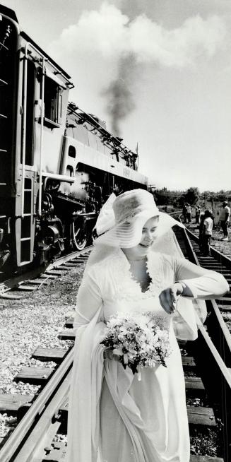 Yes, she did get to the church on time: Bride-to-be Mary McEachern checks watch before ceremony