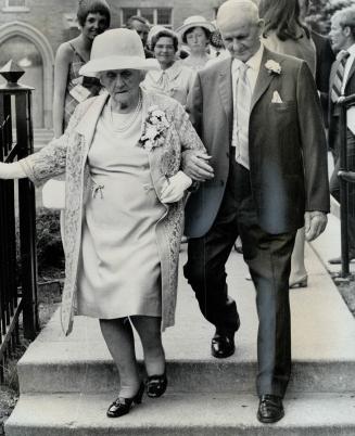 Mr. and Mrs. George Ross, They're leaving church after wedding yesterday