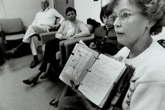 Dr. Guy Prouix, left, helps a group of amnesia patients improve their memories