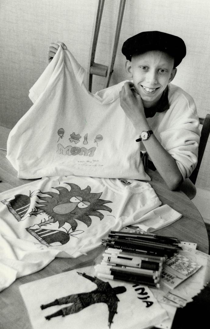 Paul Starkey shows off the T-shirt he made for his mother while recovering from leg cancer