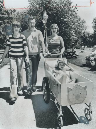 Young patient gets an outing, Four-year-old Joann Armsworthy, who's in Princess Margaret Hospital for treatment, gets a ride through Allan Gardens yes(...)