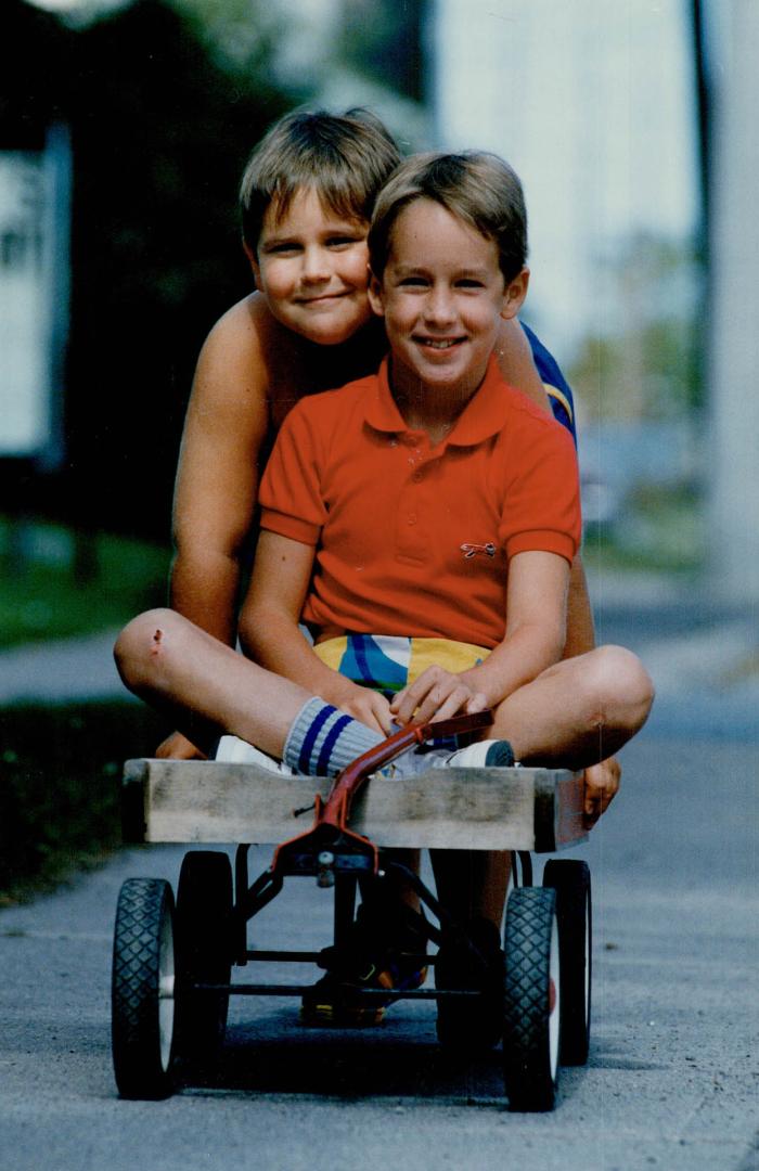 Jeff Haffie pushes his brother Brad in the same wagon the boys used to ride in when they did the Napanee Terry Fox Run as toddlers