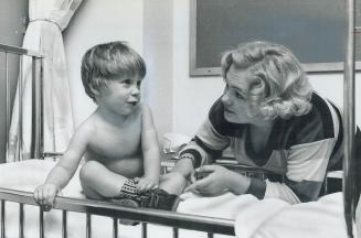 Scott Walpole and mother Wendy pictured before the heart operations