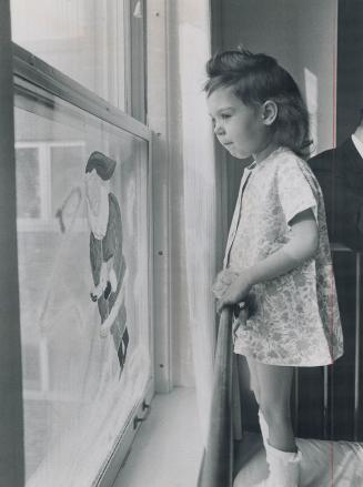 Hope for a young heart, Allyson Beanna Burleson, 5, takes in the pre-Christmas scene from her Hospital for Sick Children window as she awaits a delica(...)