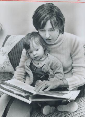 Kidney patient Diane spencer, 21, home from hospital for visit, reads to daughter, Emma