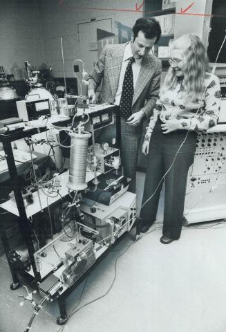 The artificial lung that saved her life is shown to 19-year-old Julie Reading of Bay Ridges by Dr. Joel Cooper, a chest surgeon at Toronto General Hos(...)