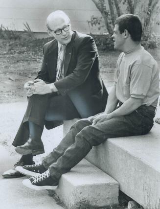 Administrator of the new complex of homes and facilities at Picton is Robert MacKenzie, seen talking to a patient