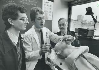 Paramedic hopefuls begin training, Trainees John Fader, left, and Glen Ruppell watch closely as program director Andrew Duncan demonstrates how to ven(...)