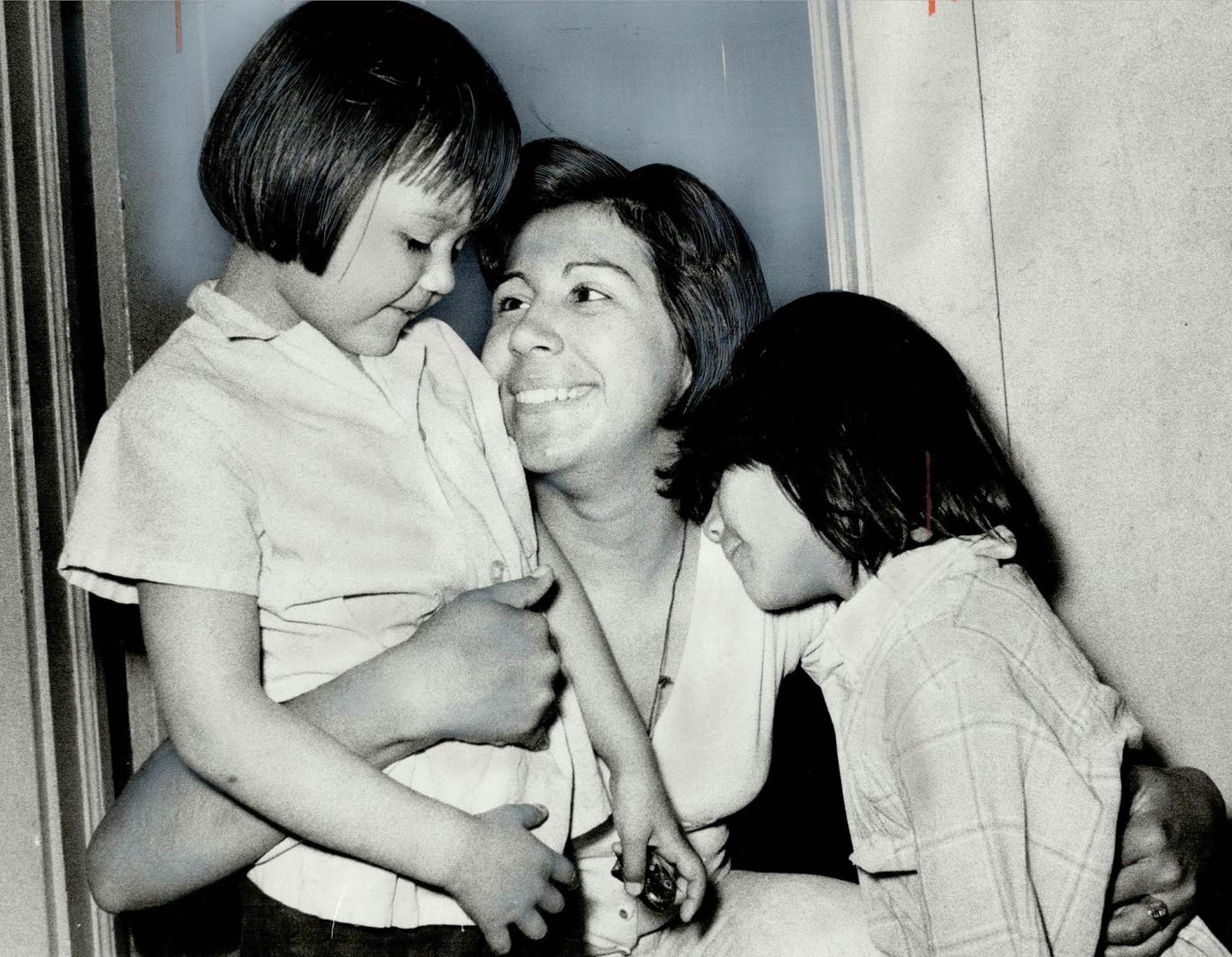 Away all night and cause of a city-wide police search, Carol, 8, (right) and her sister, Robin, 4, are welcomed home today by their mother, Barbara No(...)