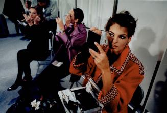 Top, the more experienced models, including Canadian born Linda Evangelista, do their own makeup