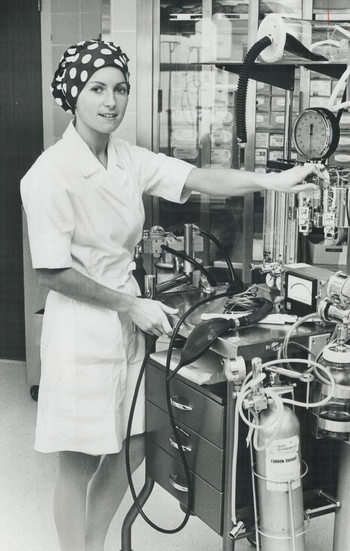 Nurses like their bright new caps, Nurse Glenice Irvine adds a spot of color to the operating room at the Hospital for Sick Children with her polka do(...)