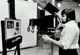 Jim Chambers works in Art Gallery Of Ontario's photography studio