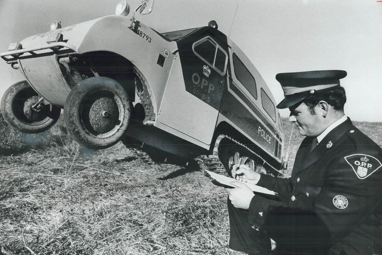 Go anywhere, Constable Doug Andrews takes notes on the Bombardier Snowmobile he's learning to drive