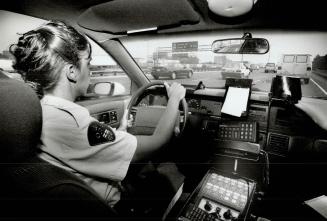 Constable Melissa Chiodo in cruiser on 401