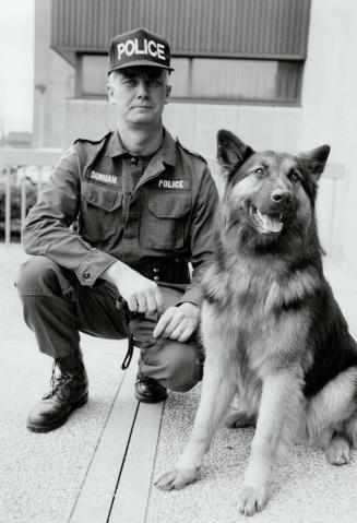 Bad luck: German Shepherd Kane, with partner Constable Peter van der Duim, no longer has a future with Durham Regional police because of faulty hips