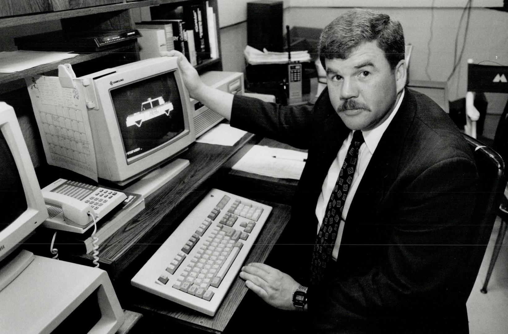 Police Computer, Detective Rick Bates of Durham Region police, at his basement computer, explains how members of the public can make inquiries of poli(...)