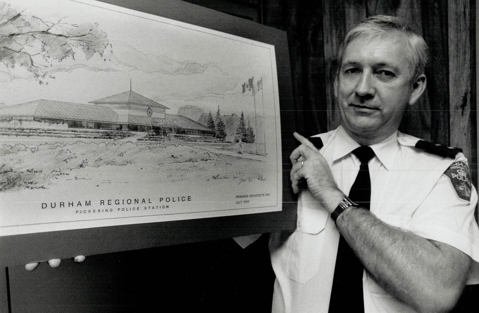 Jim Fishley, a Durham police inspector, shows architect's sketch of Pickering station