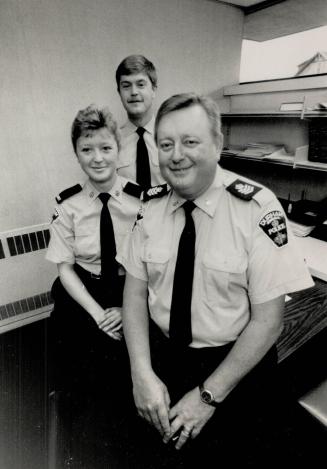 Family tradition: Durham Region's Joe Loughlin, foreground, with police cadet daughter Sherri and son Dave, a constable in Metro's 41 Division