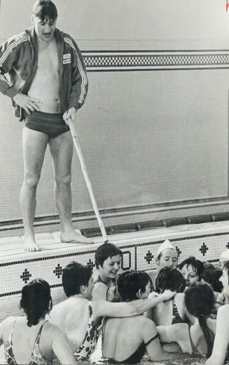 Recruits struggle for the ball during a water polo game