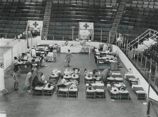 Blood Flowed in Varsity arena today as hundreds of people turned out to help the Red Cross replenish Metro Toronto's seriously depleted blood bank. Lo(...)