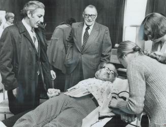 His 100th gift of blood, Making his 100th blood donation, yesterday at a clinic in Ajax, postal worker Robert Andrew of Ajax is surrounded by Ajax May(...)