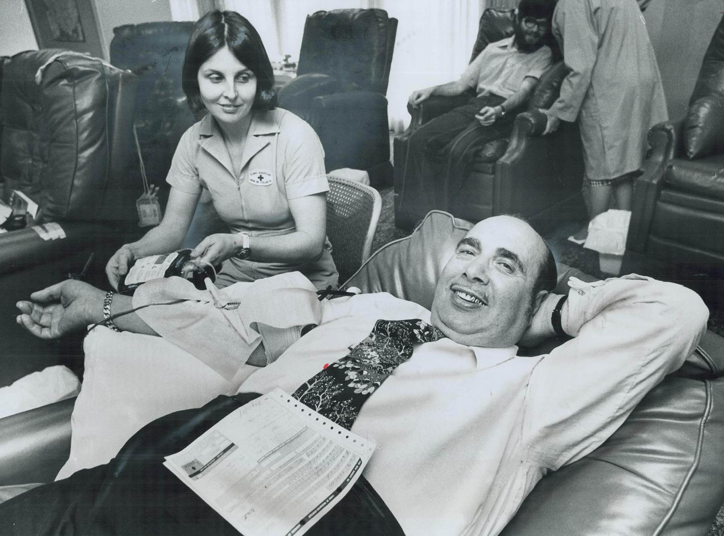 Giving his 644th pint of blood, Red Cross workers open doors when Joseph Elmaleh comes to town