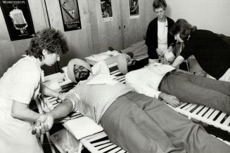 100 Sikhs help restore blood banks, Bhag Singh Hansra (left on bed) and Kamaljit Singh Niggar were among about 100 members of the Sikh Youth Federatio(...)